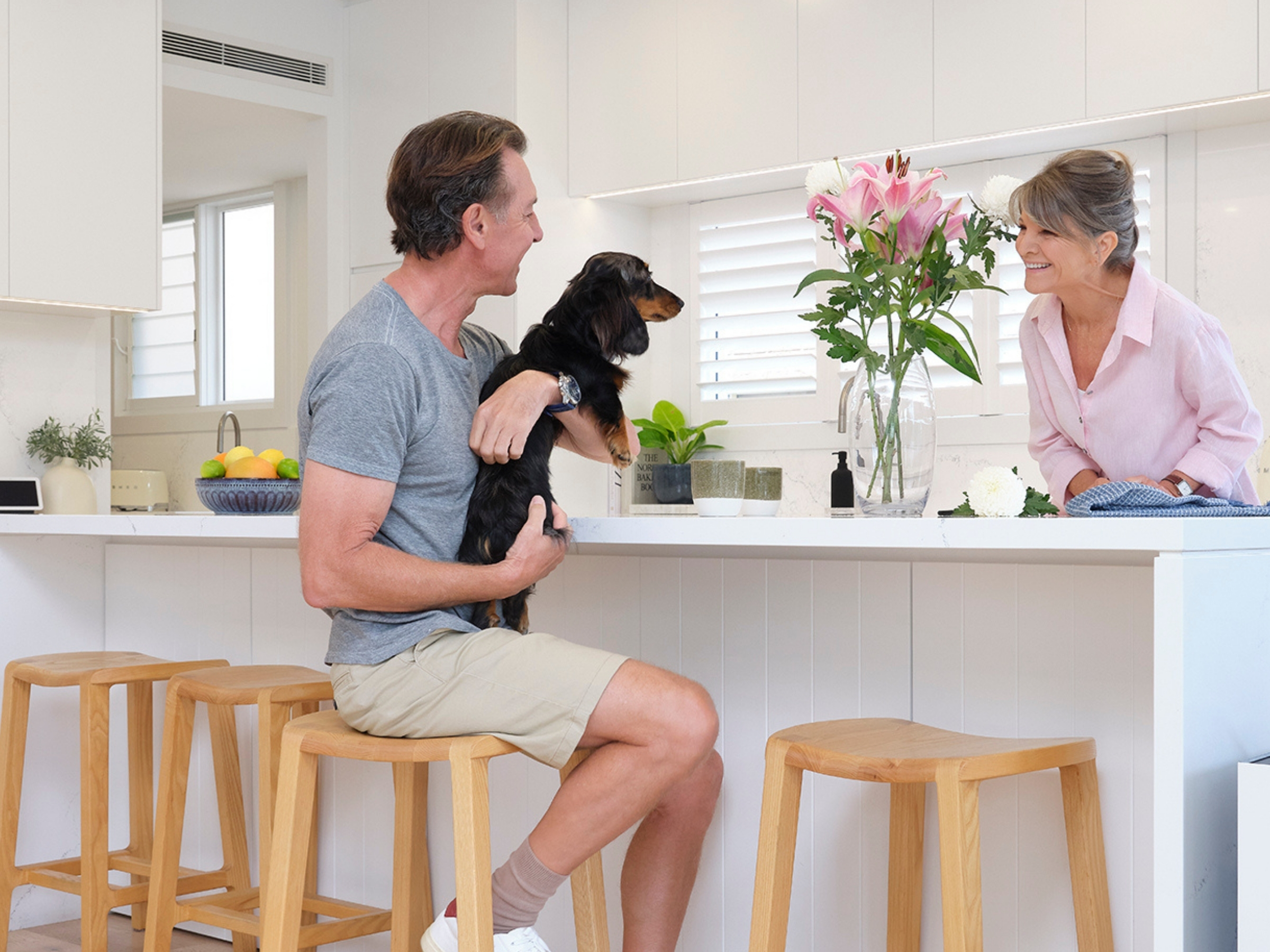 Couple discussing over coffee with Daikin comfort — Sunshine Coast