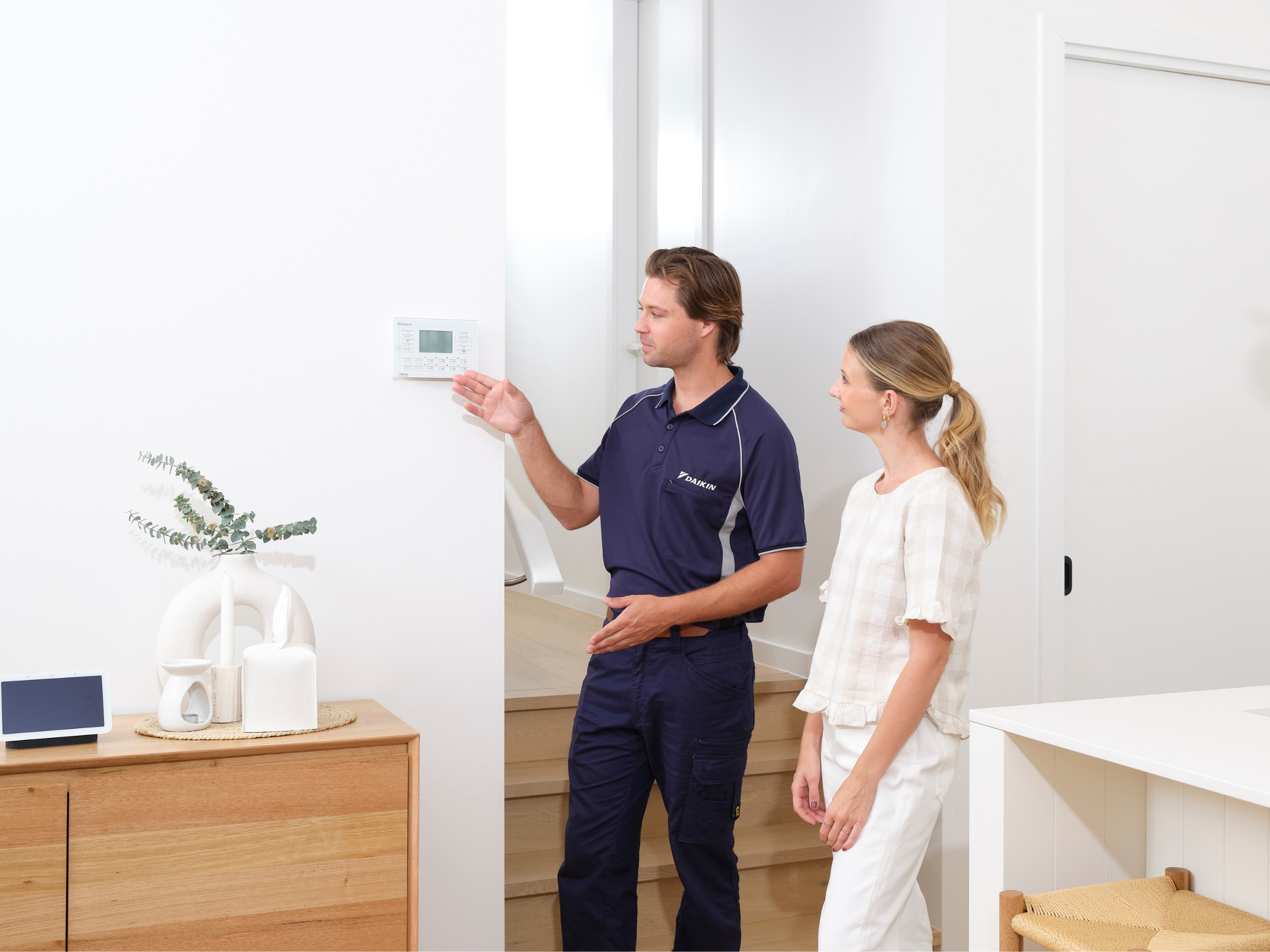 Daikin technician explaining system — Sunshine Coast