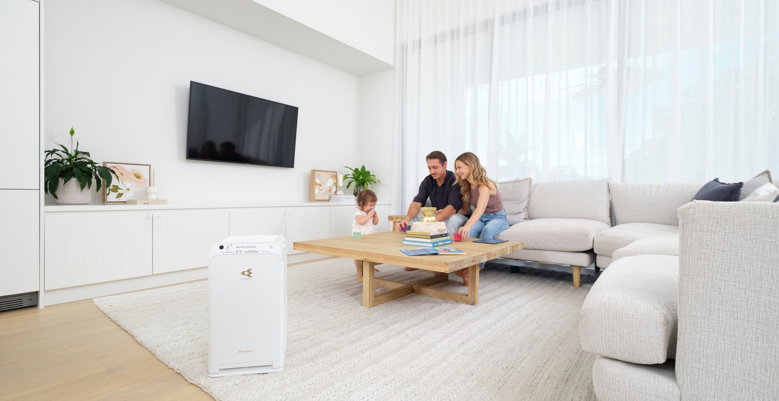 Family game night with Daikin air purifier on the Sunshine Coast, enjoying clean air and comfort