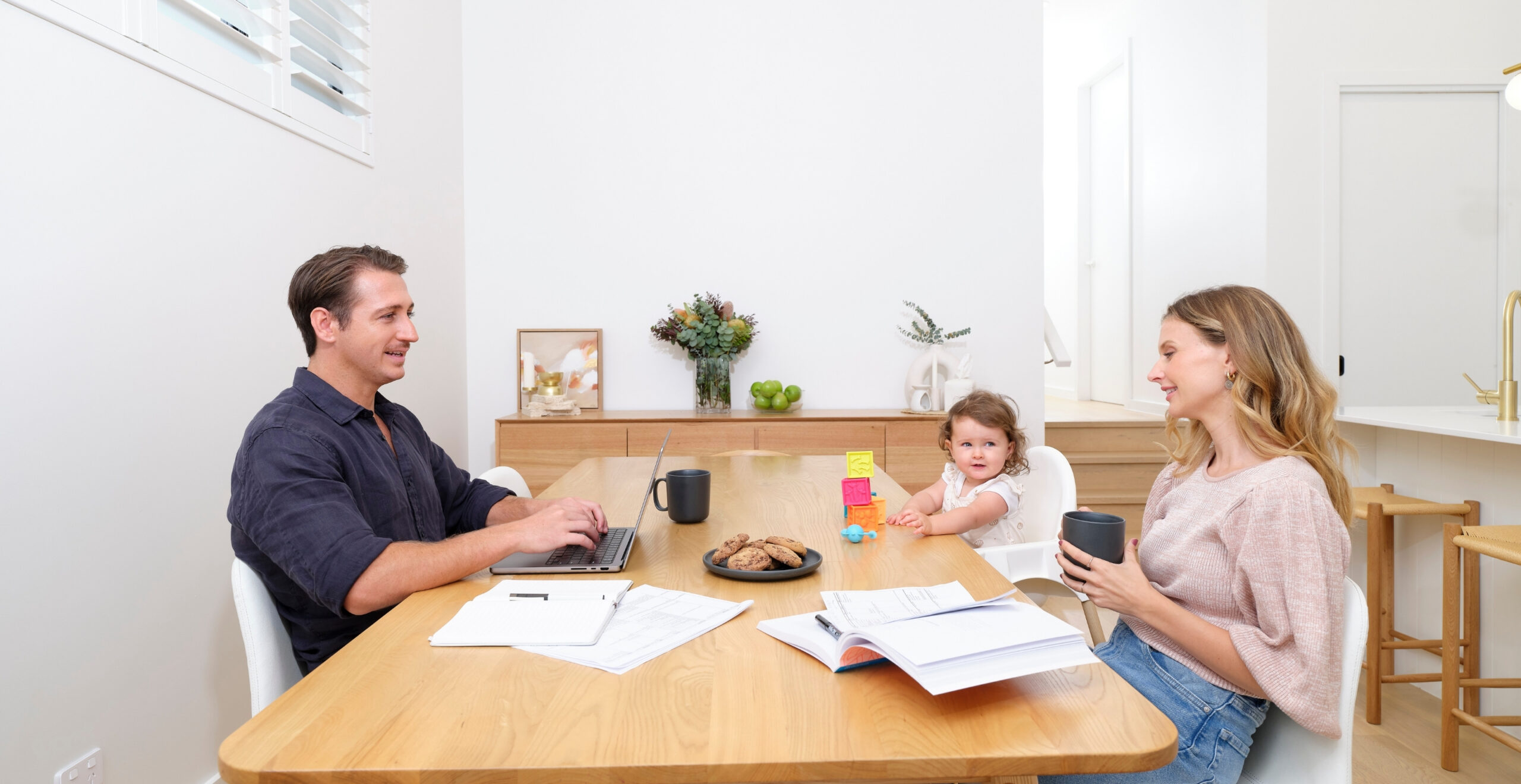 Family mealtime and work in Daikin air conditioned home on the Sunshine Coast, enjoying comfort and productivity