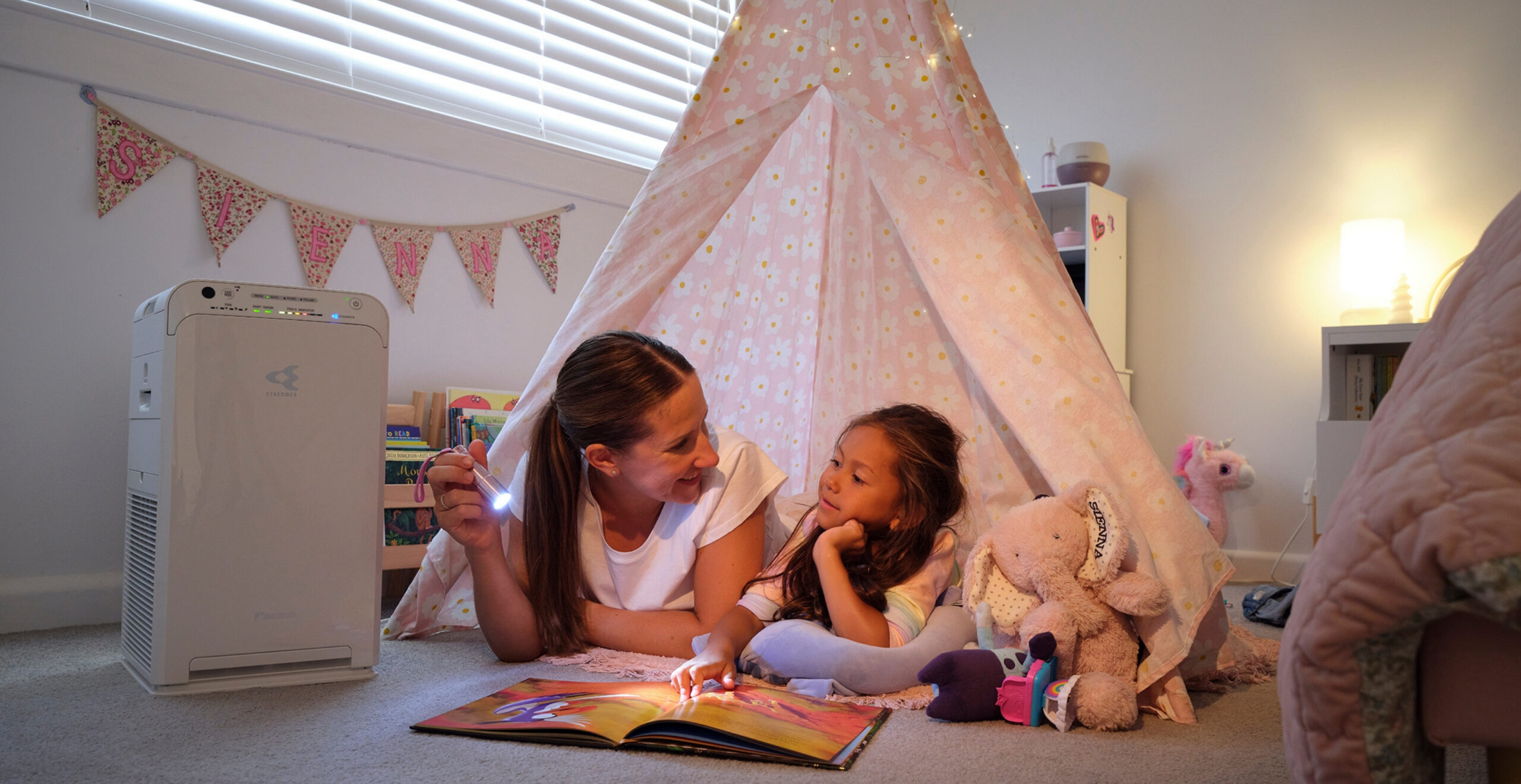 Kids playing in indoor fort with Daikin air conditioning comfort on the Sunshine Coast