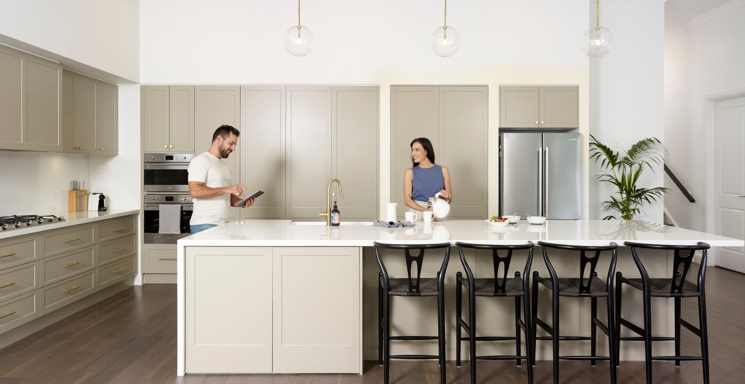 Preparing meals in Daikin air conditioned kitchen on the Sunshine Coast, enjoying comfortable climate control