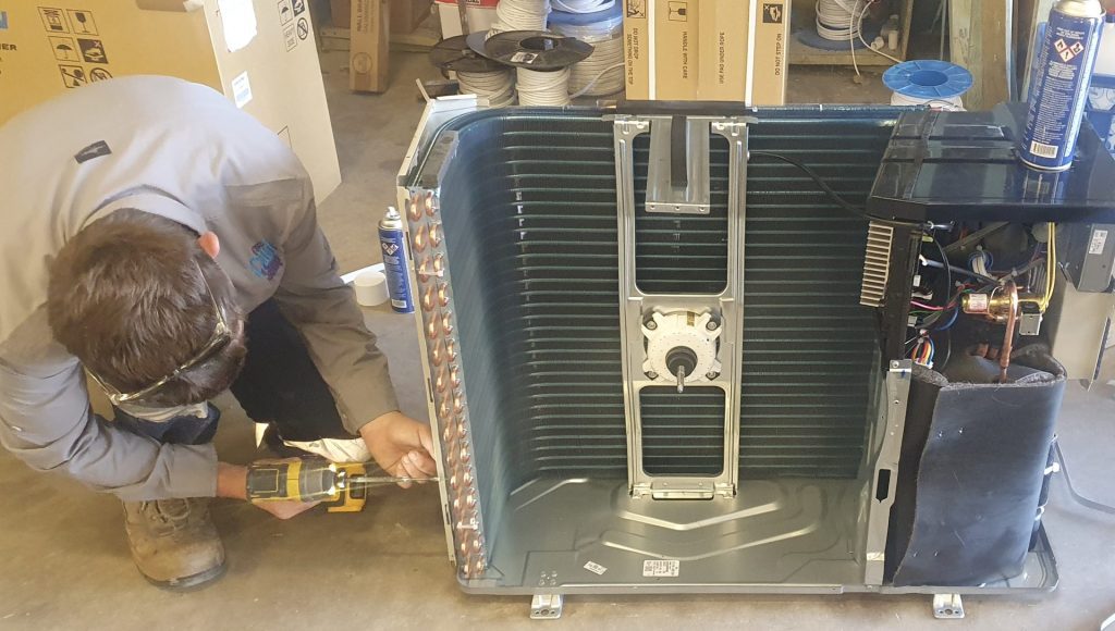 Outdoor air conditioning condenser unit protected with rust prevention coating, essential maintenance service from The Cool Shop for Sunshine Coast coastal properties